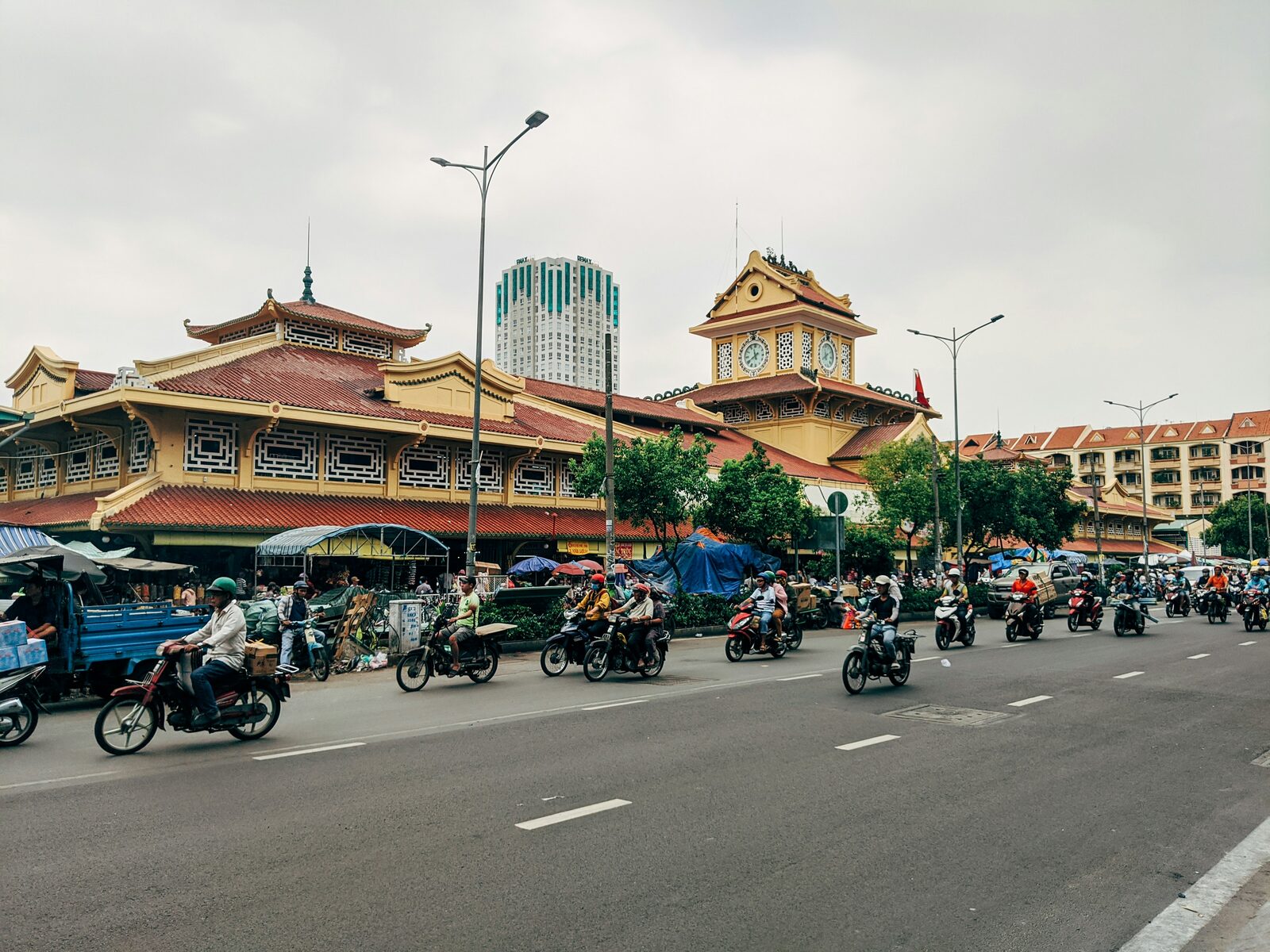 A busy market and motorbike street in Ho Chi Minh City
