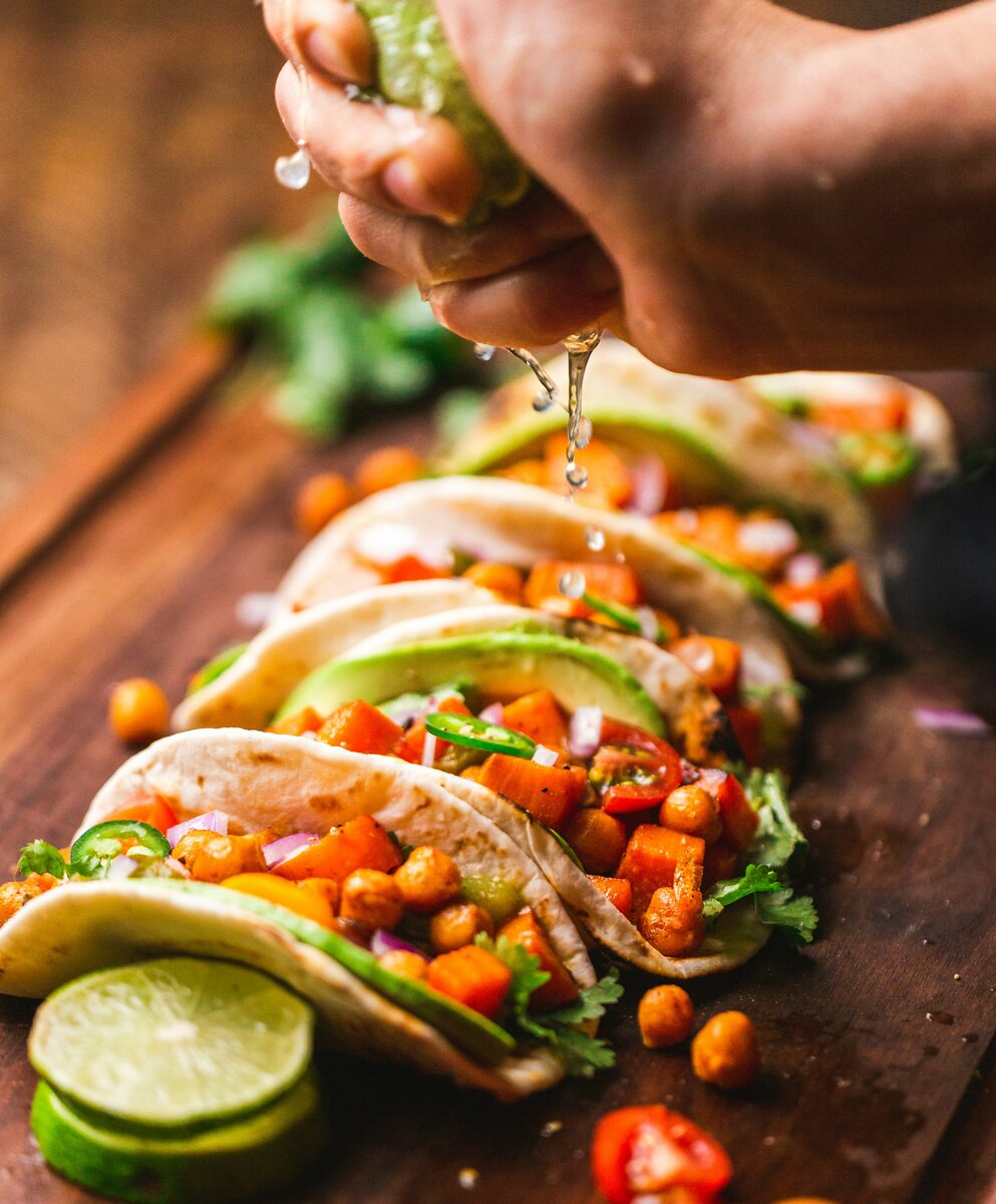A plate of Mexican tacos with fresh toppings